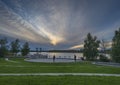 People in Somba KÃ¢â¬â¢e Park on Frame Lake at Sunset